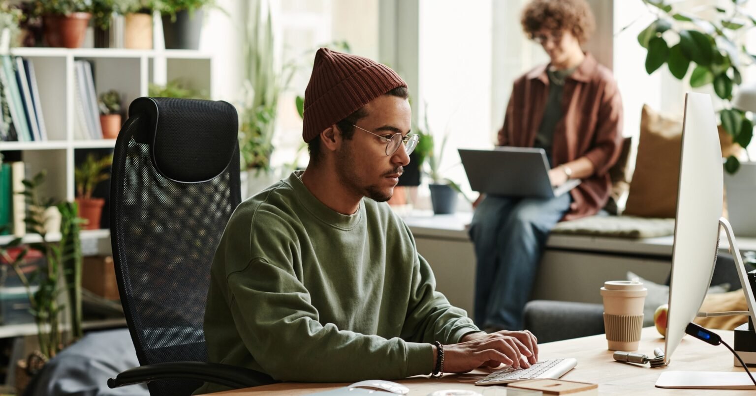 Young serious webdesigner working over new website